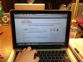 Photograph of my laptop with the Sweetland Minor in Writing blog displaying on the screen